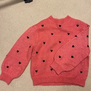Pink sweater with heart print